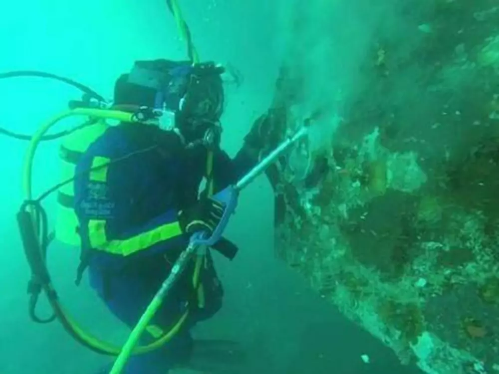 cleaning-barnacles-from-floating-aquatic-inflatables-underwater