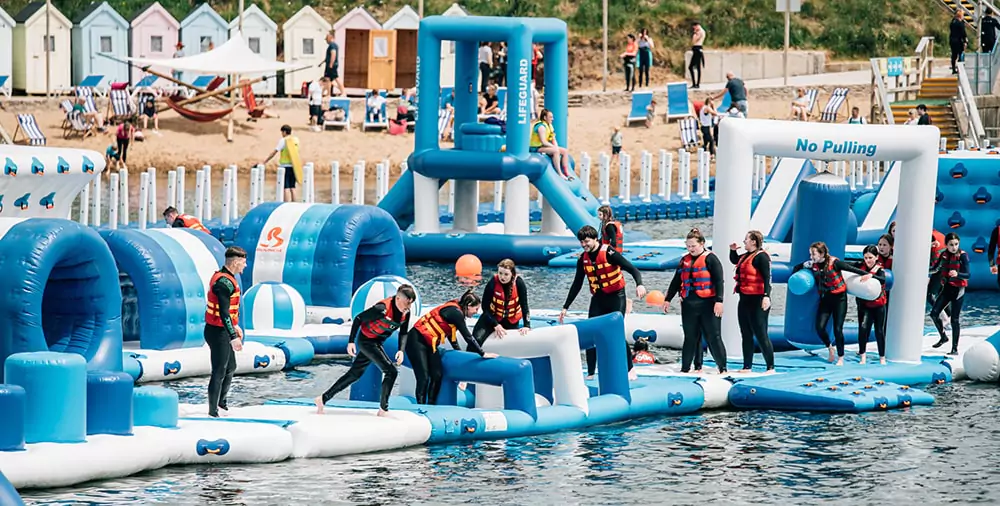 visitors-wearing-buoyancy-vests-on-inflatable-aquapark