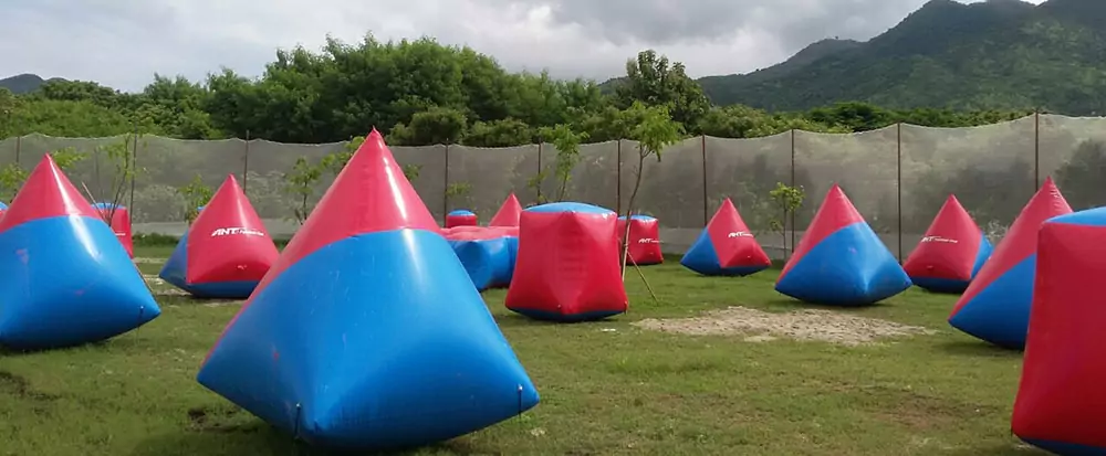 fully-inflated-paintball-obstacles-standing-firm-on-grass-field