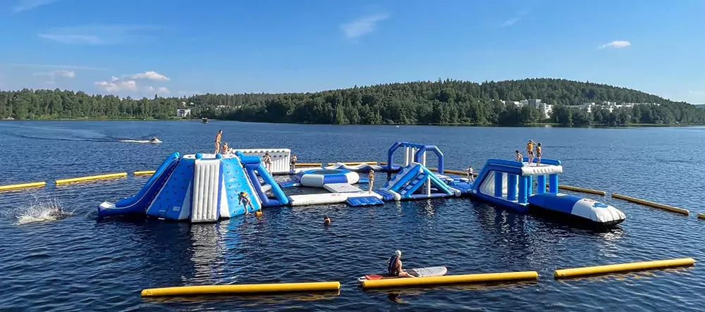 visitor-playing-on-floating-water-park-equipment