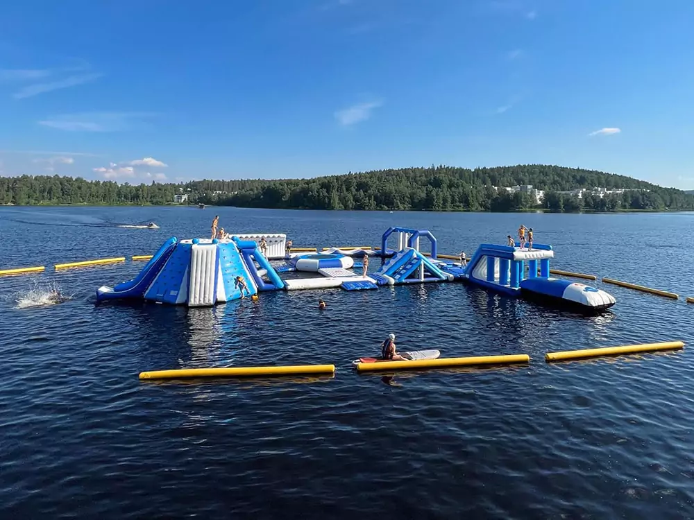 visitor-playing-on-floating-water-park-equipment