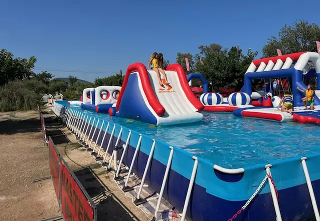 a-floating-water-park-is-installed-in-a-metal-frame-pool