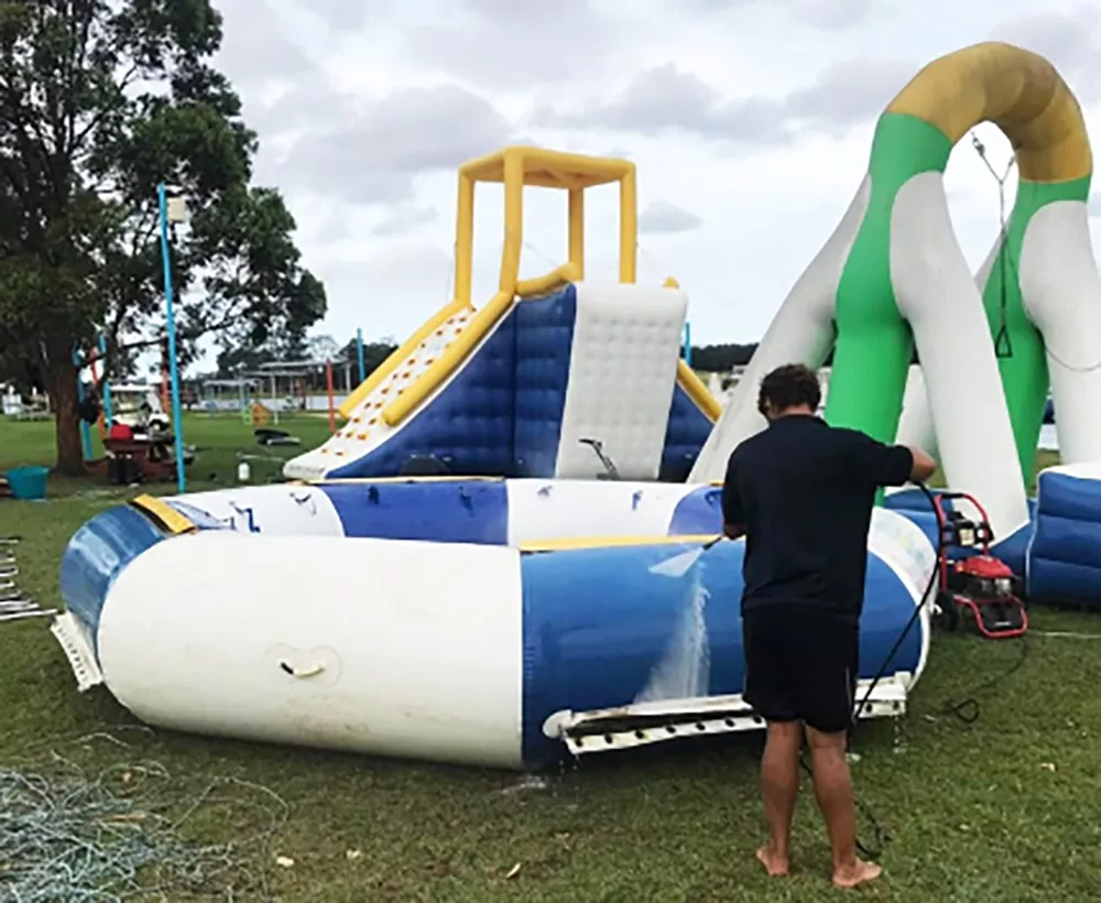 staff-cleaning-commercial-inflatable-water-park-equipment