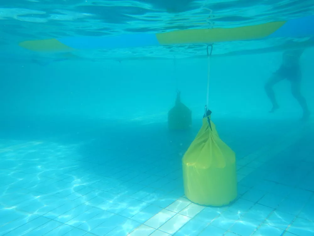 floating-water-park-sandbag-anchoring-in-pool