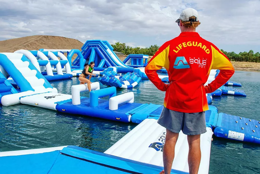 lifeguard-supervising-an-inflatable-aquapark