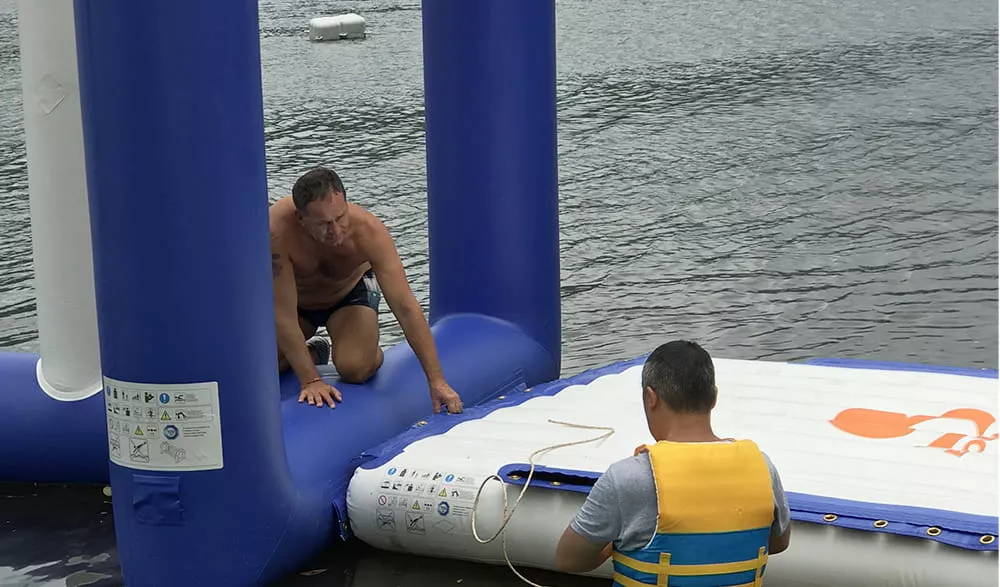 staff-checking-inflatable-floating-water-park-connections