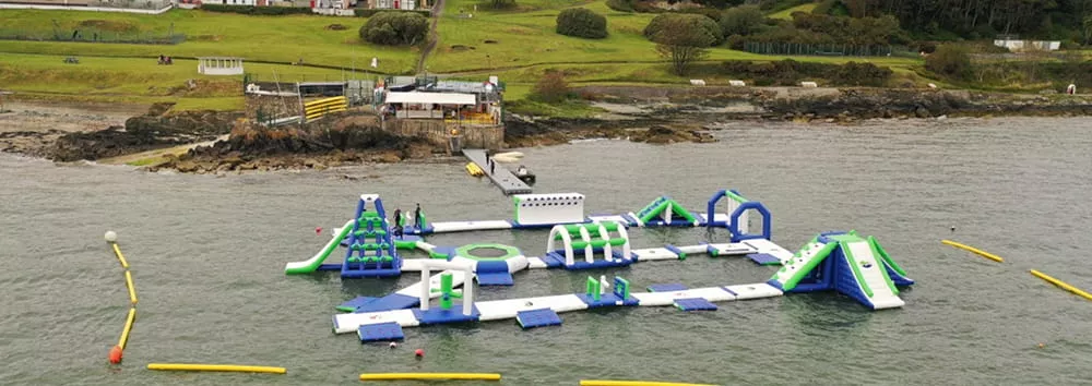 staff-inspecting-inflatable-floating-water-park