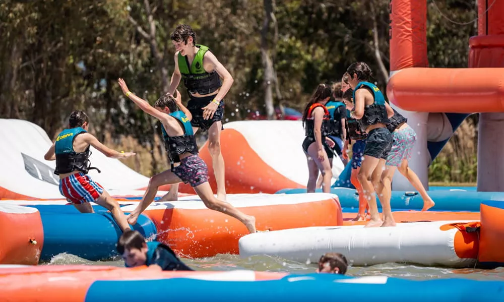 guests-enjoying-an-commercial-inflatable-water-park-with-friends