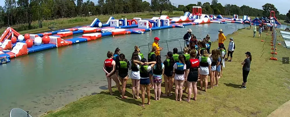 staff-briefing-guests-before-commercial-inflatable-water-park-entry