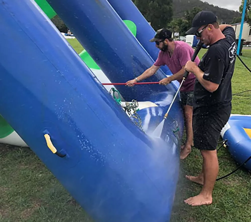 staff-cleaning-an-inflatable-water-park-module