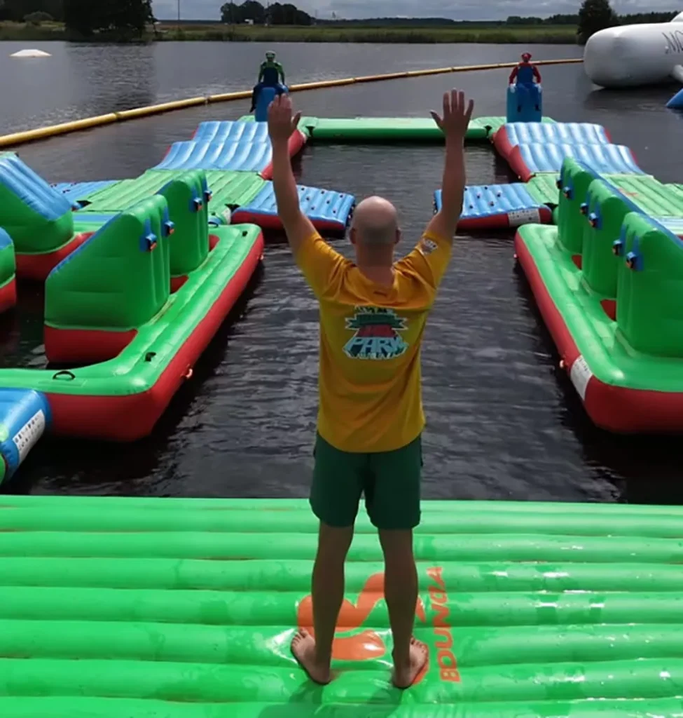 staff-guiding-double-lane-floating-inflatable-obstacle-course-race