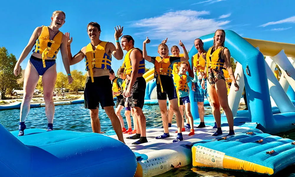 young-visitors-enjoying-an-inflatable-water-park