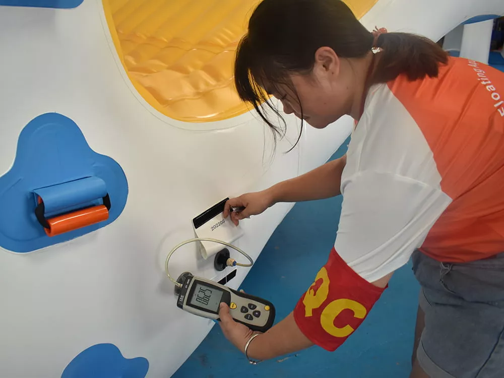 inflatable-water-park-pressure-check-at-air-valve