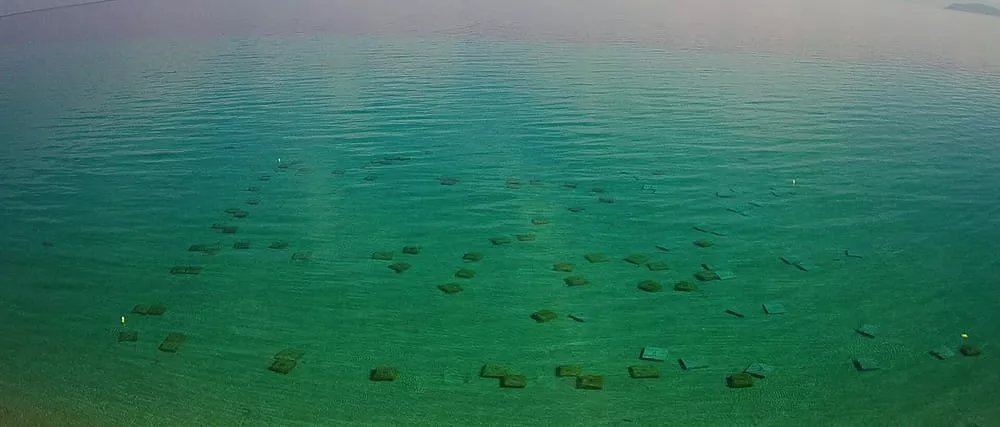 Underwater concrete anchors positioned according to the inflatable water park site plan