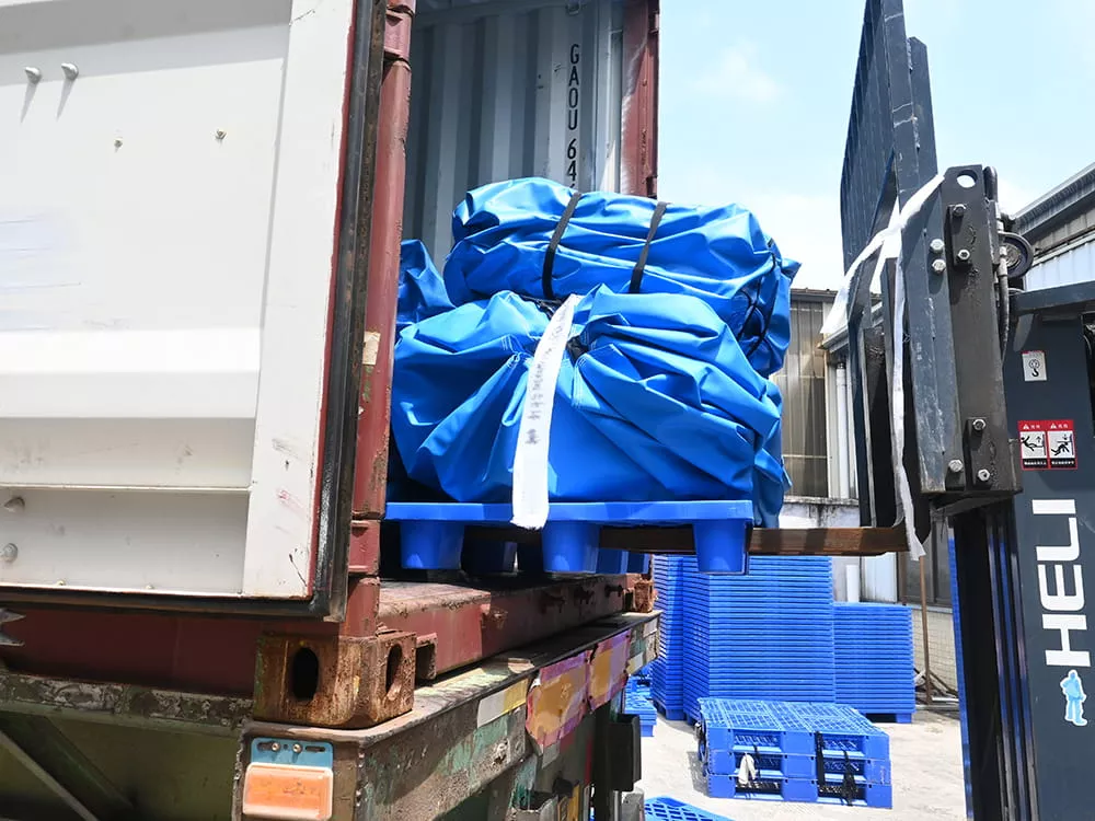 forklift-loading-packed-floating-obstacle-course-modules-into-a-shipping-container