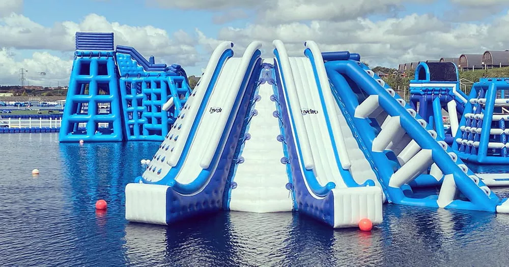 floating-water-park-equipment-with-tall-slides-and-climbing-features
